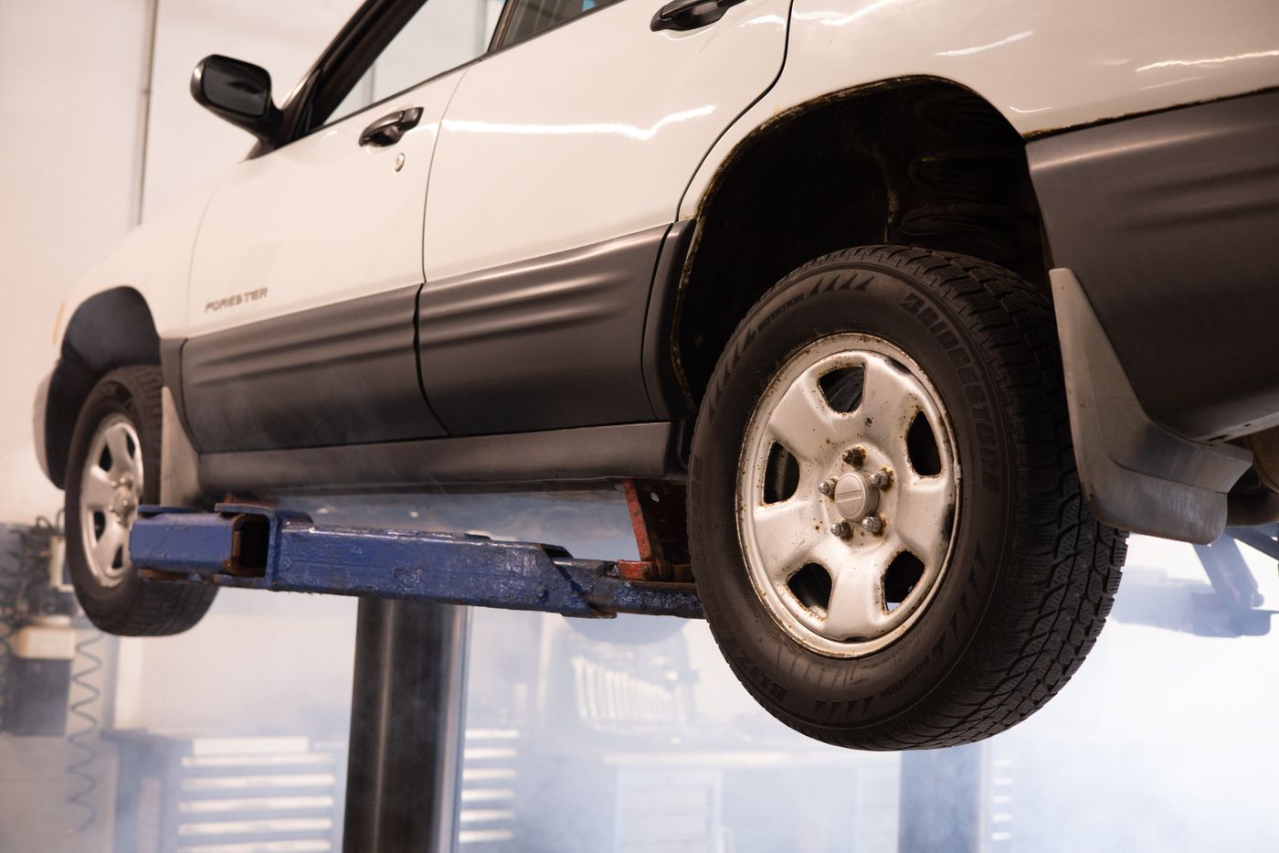 A car raised on a workshop lift